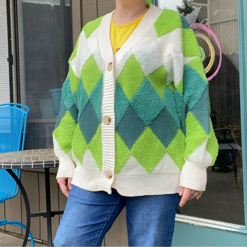 Green and cream harlequin patterned button up sweater